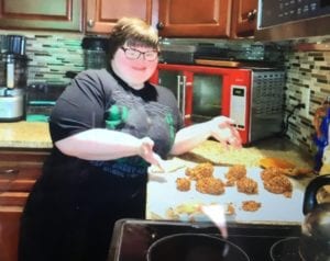 Anna W posing next to her Healthy No Bake Cookies
