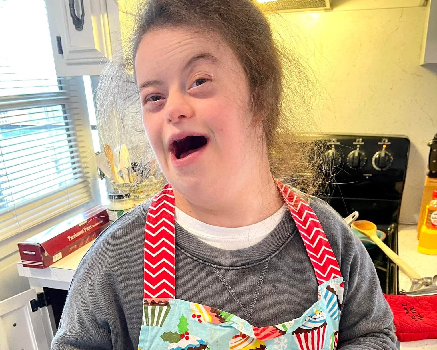 Maddie holding a bowl of ramen