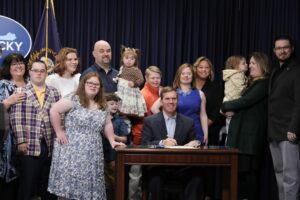 DSL members, staff, and families with KY Governor Andy Beshear, as he signs the Kentucky Nondiscrimination Organ Transplant Bill (HB238)